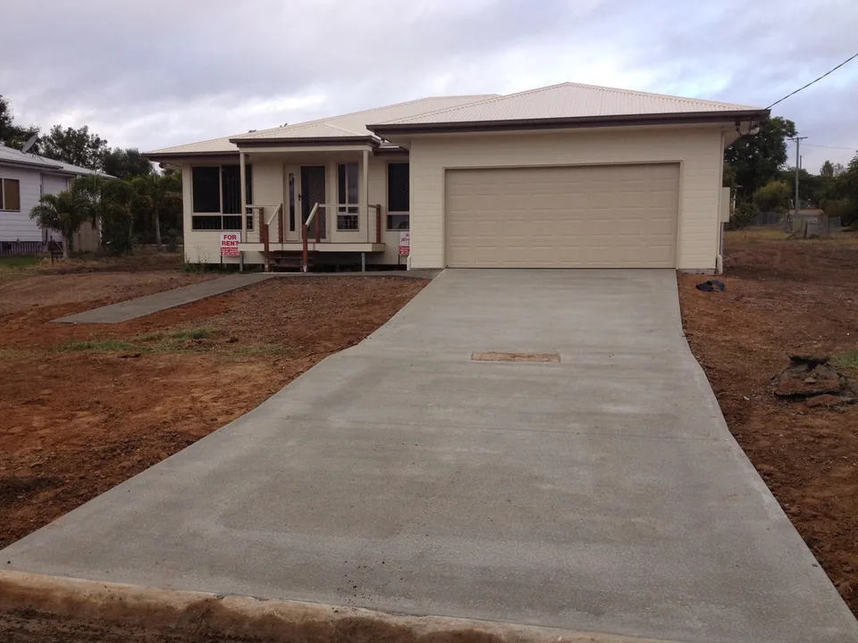 Concrete driveway leading to a residential garage.