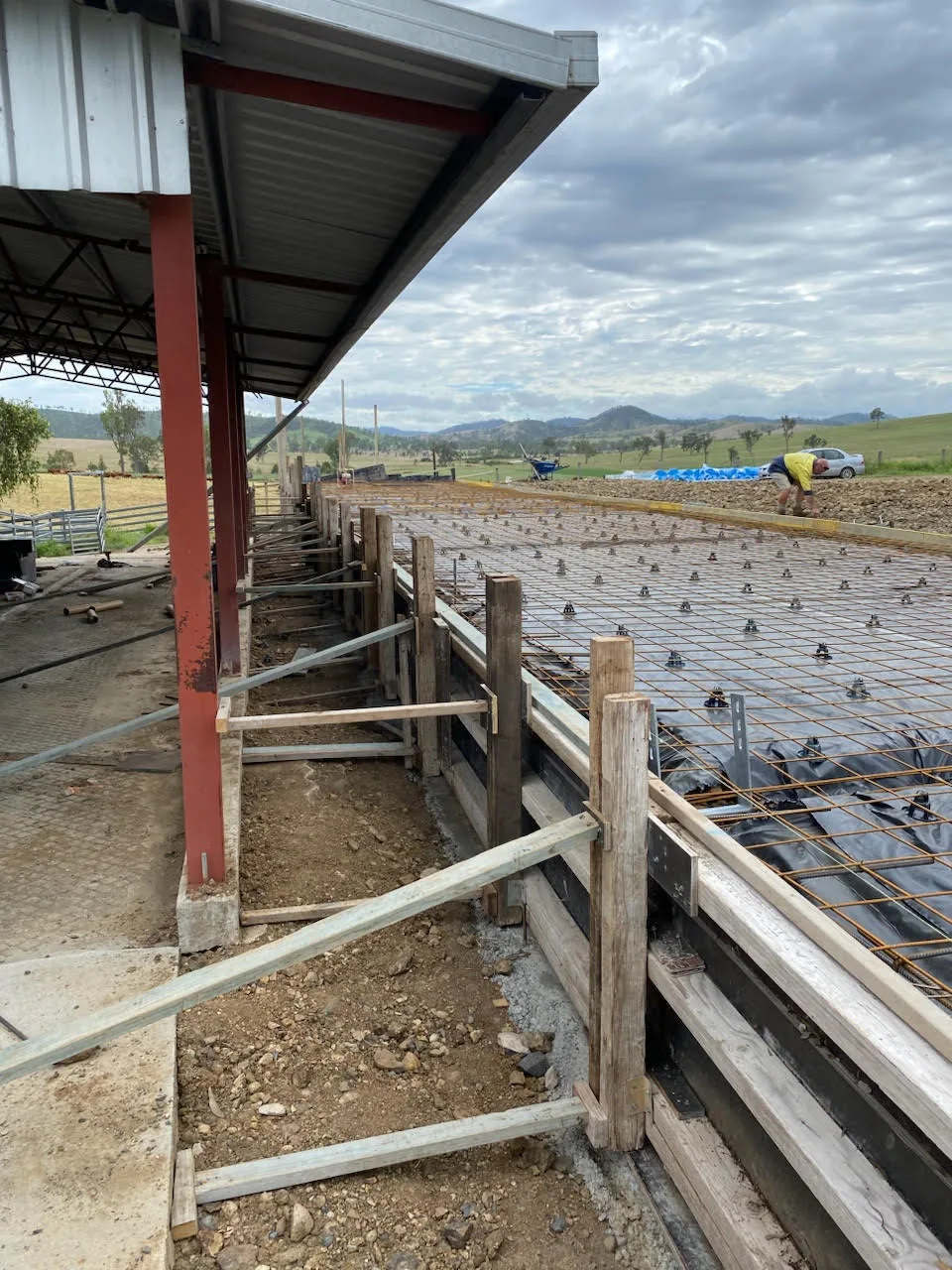 Slab reinforcement beside an open-sided structure.